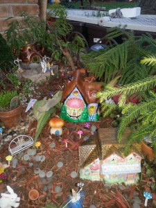 My tiny fairy village is coming along, a bakery, a boutique and a teapot house.